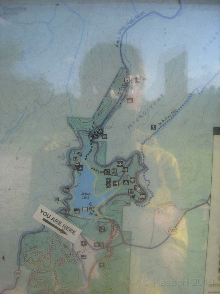 Helen to Unicoi 2010 0420.jpg - A washed out map in plastic with a ghost in the window.